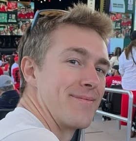 Myles Dawson looking at the camera from a concert venue